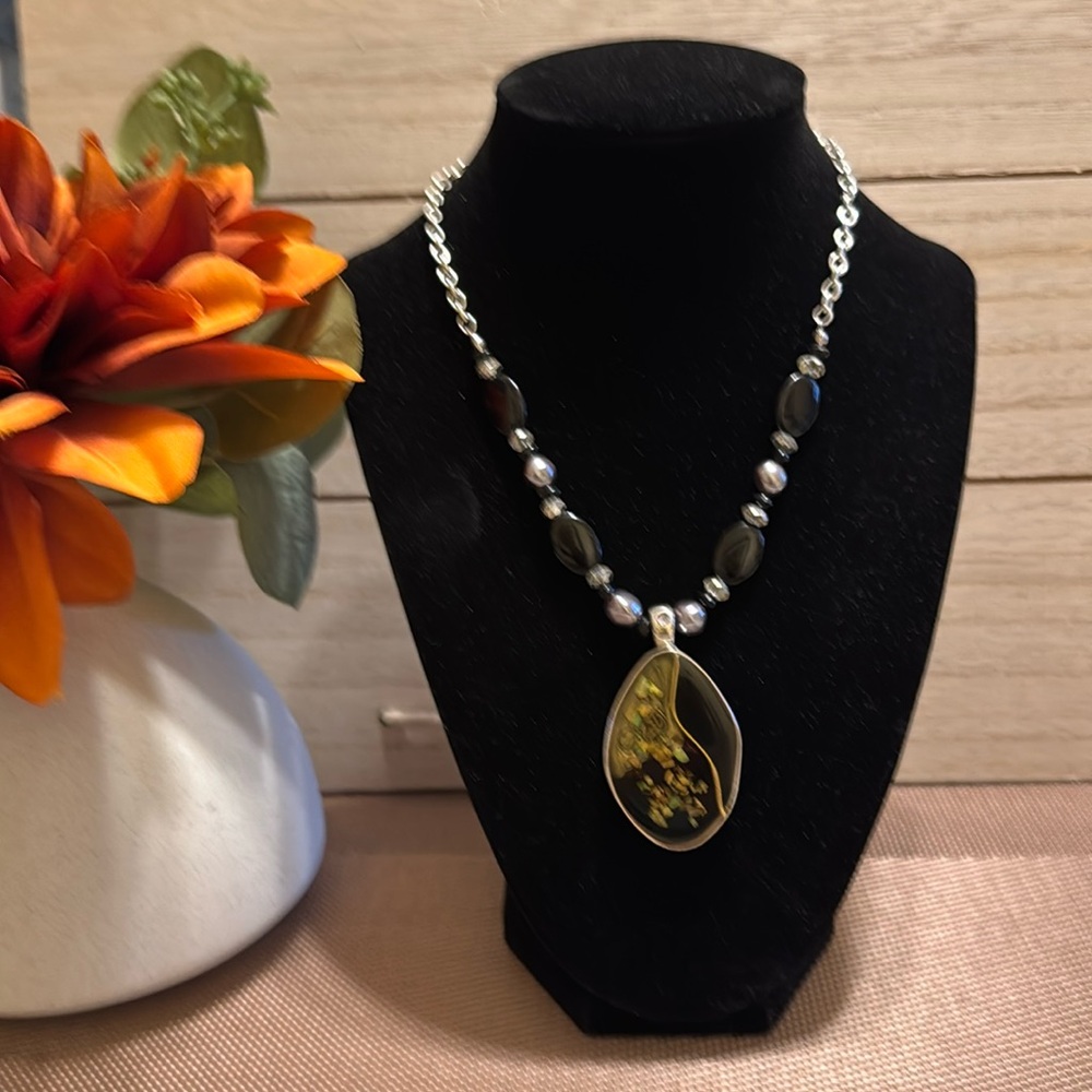Kenneth Cole oval black enamel and abalone set in silver tone pendant necklace